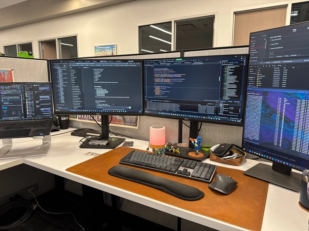 Tim’s ATEC workstation with a laptop, multiple monitors, and development tools