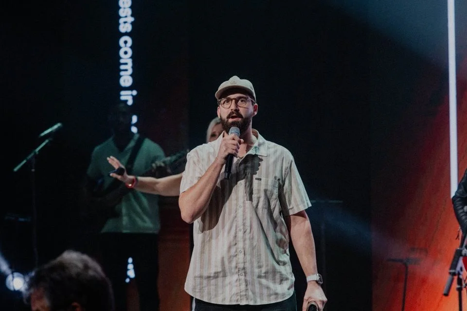 Speaking into a microphone during a church service