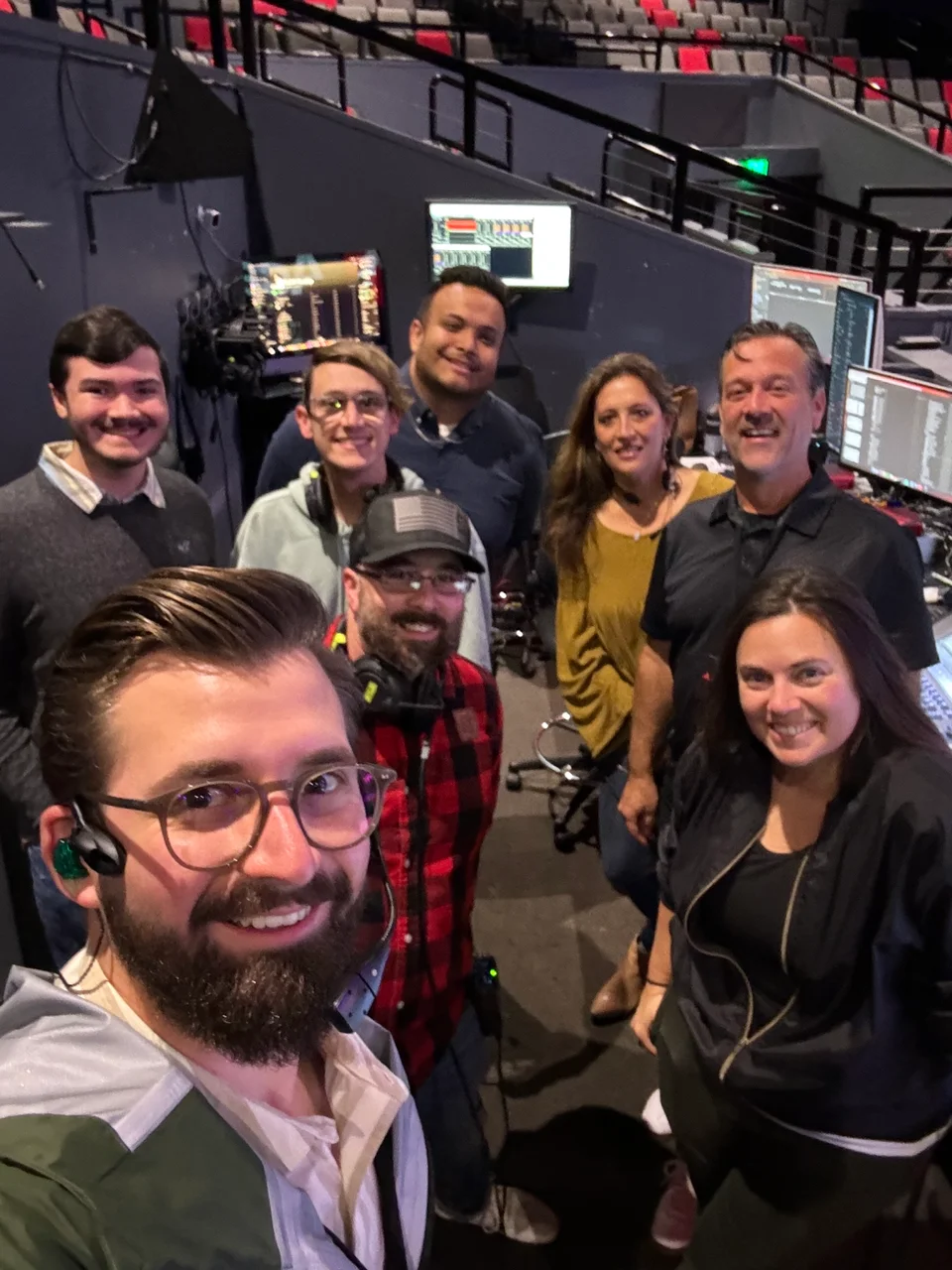Tim taking a group selfie with the production team in the church booth.